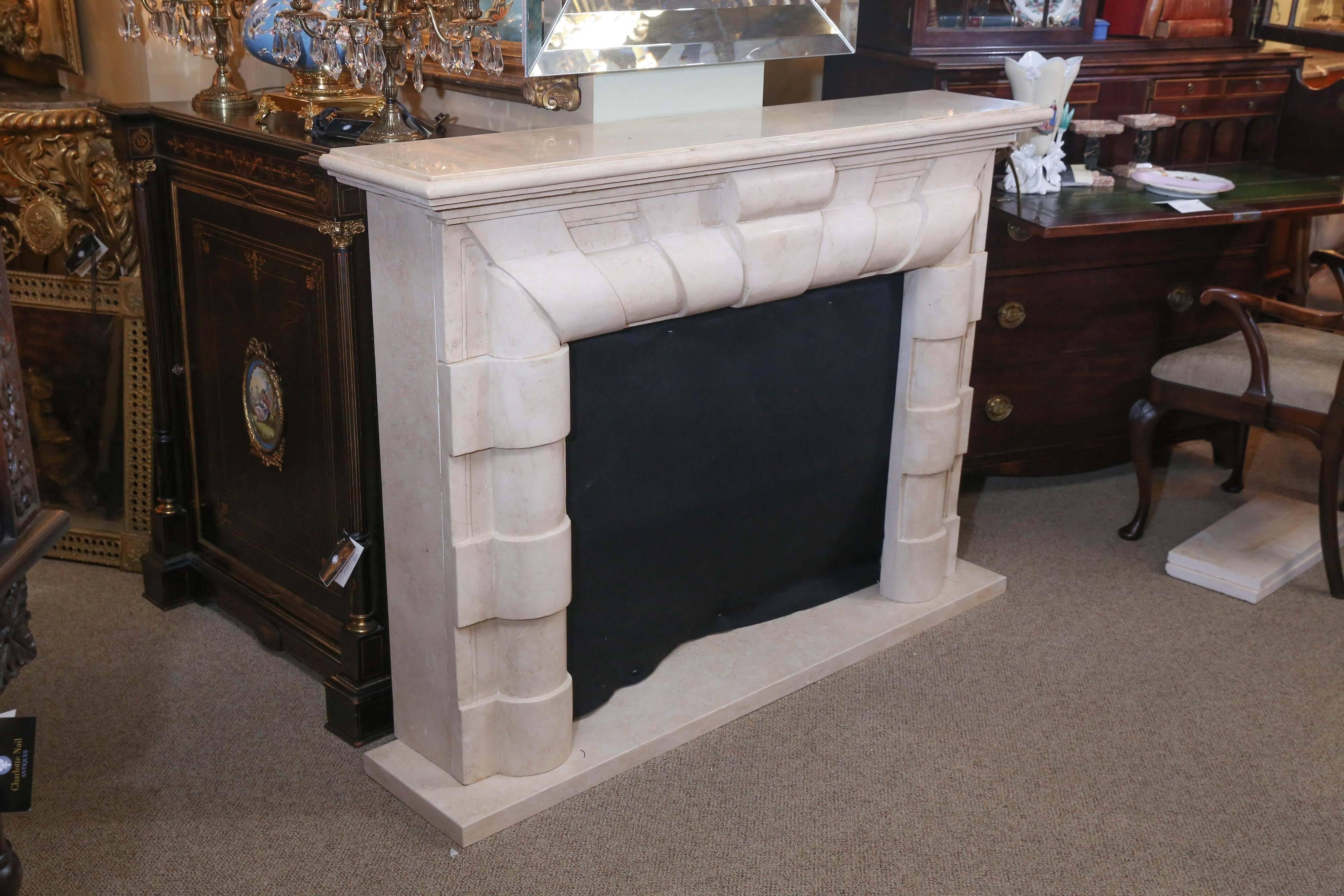 Art Deco style mantel carved in real marble that has been beautifully crafted.
New mantel with great style. Hearth is provided and this comes apart in five
pieces for easy shipping.