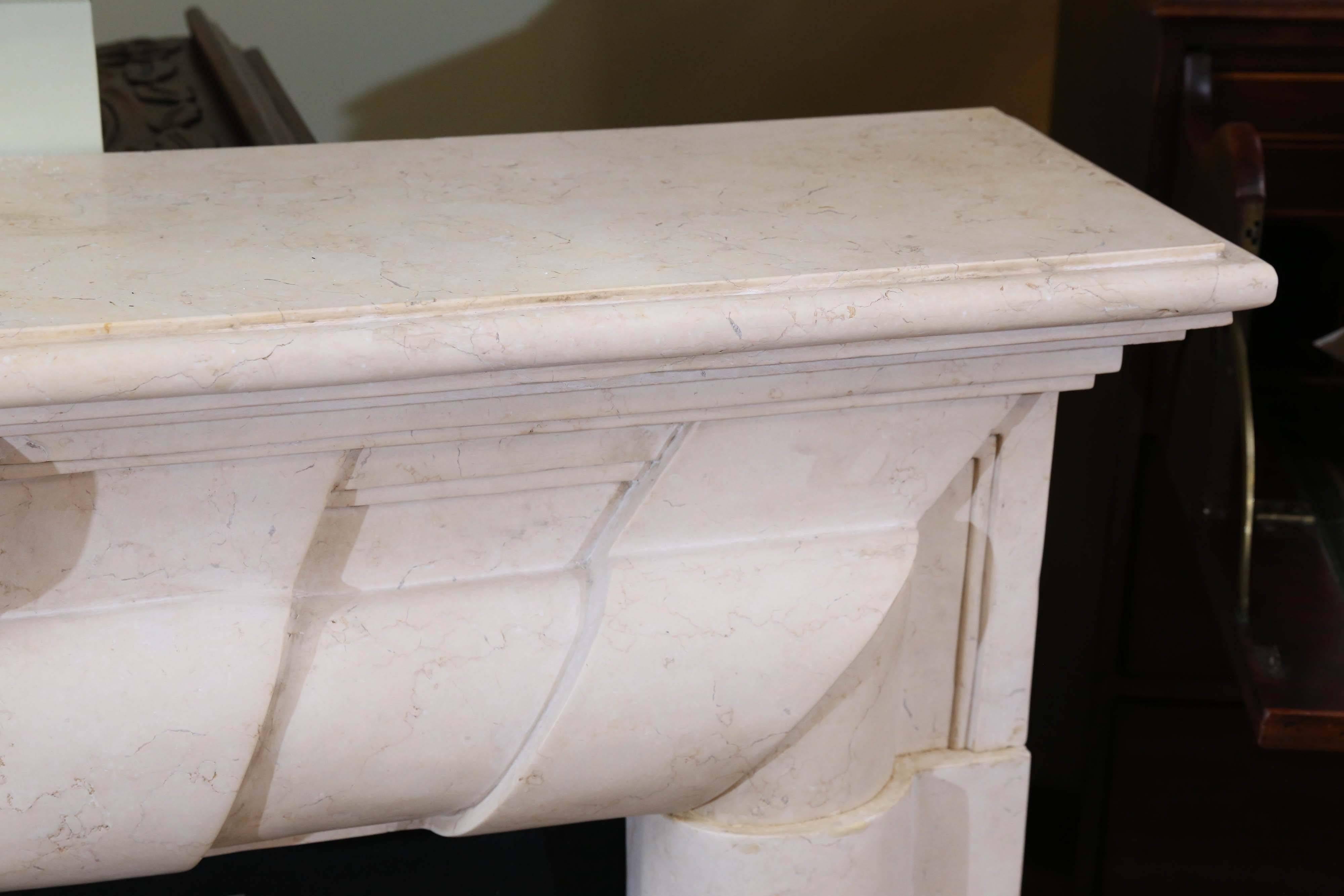 Marble Mantel in Art Deco Style, Hand-Carved Stone in Pale Cream Color In Excellent Condition In Houston, TX