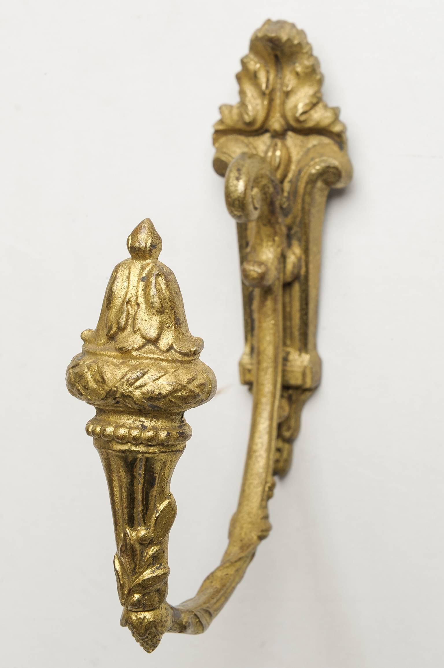 Pair of old bronze curtain supports for wall hold up . It makes elegant any window, but may be  also for belt or scarf or anything.
 On disposal many other ones: 2 - 4 - 6 supports - See on 1stdibs.
O/6770-6.
On request I can do gilding : price