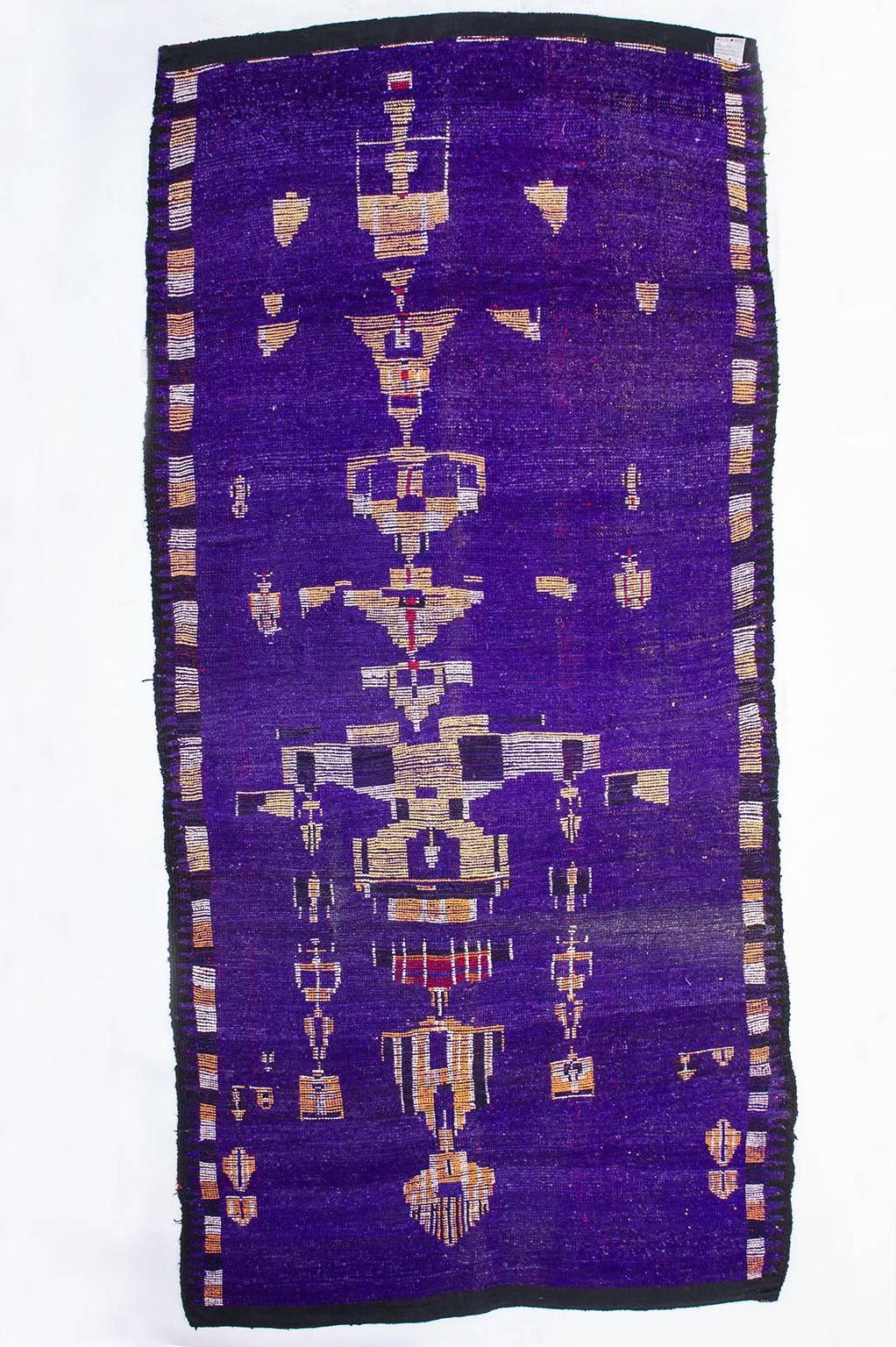 Unbelievable shades of purple for this unusual Moroccan carpet. with a long majestic chandelier design -
Rare old Moroccan carpet with an unbelievable blue-light blue-violet field color, in various shades, and an unusual drawing that occupies the