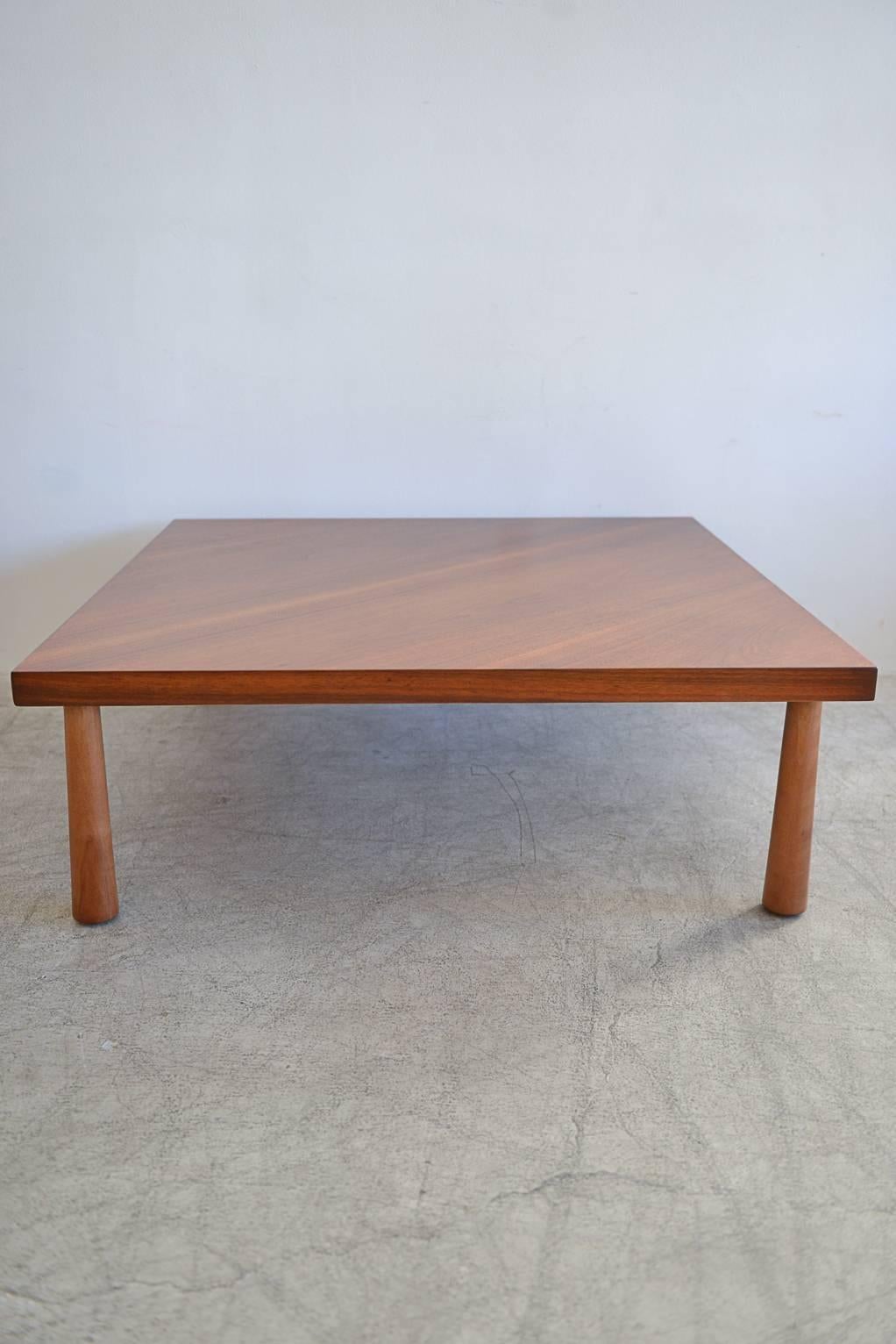 This is model 1636 from Widdicomb Furniture Company, designed by T.H. Robsjohn-Gibbings. Rare bias cut walnut top with inverted cone solid walnut legs. Table has been meticulously restored in showroom condition. Marked on underside. Made in