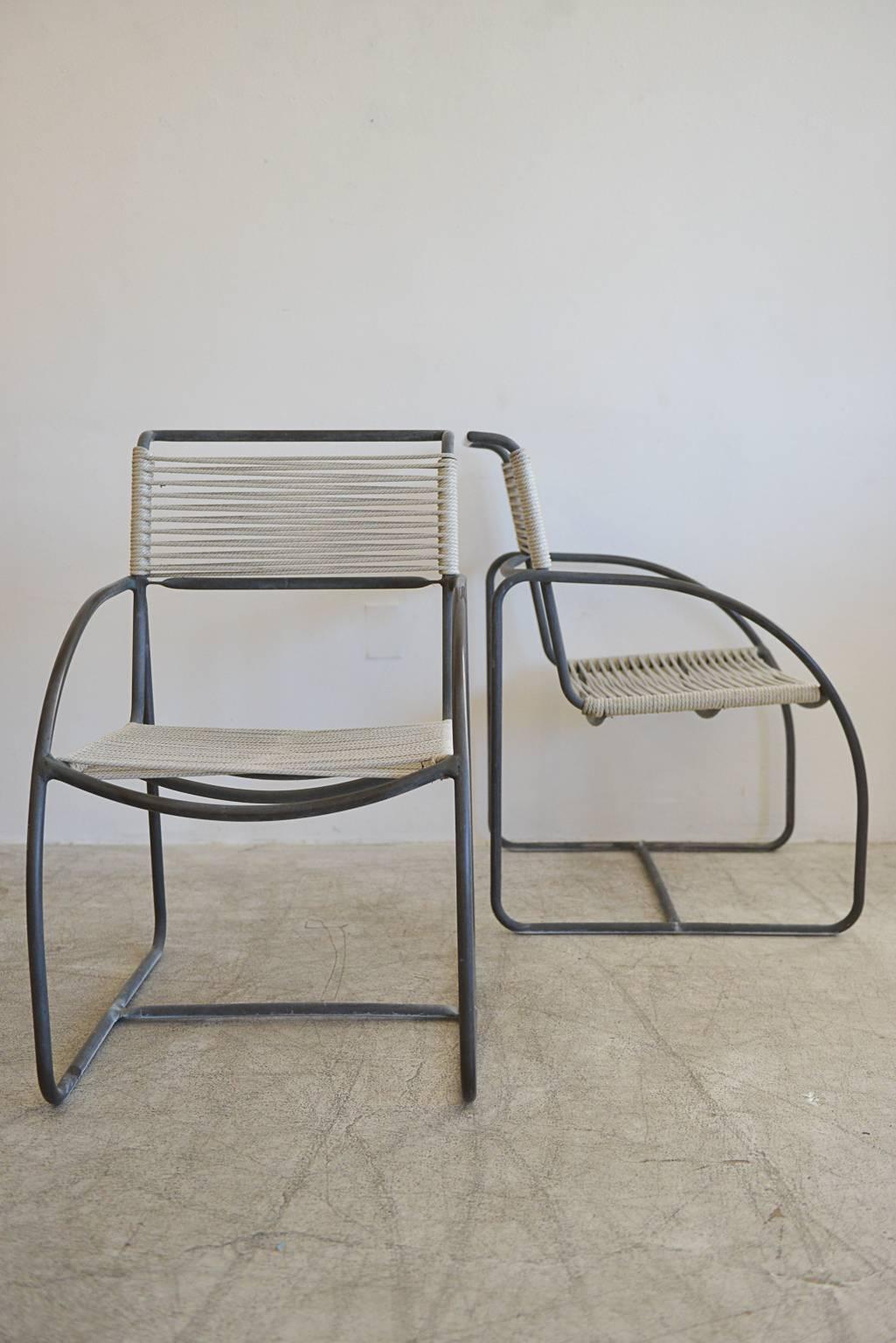 Important pair of tubular bronze and cotton cord patio lounge chairs designed by Kipp Stewart for Terra of California. Made of tubular bronze with cotton rope cording, these are often misattributed to Walter Lamb's work. Only produced for a very