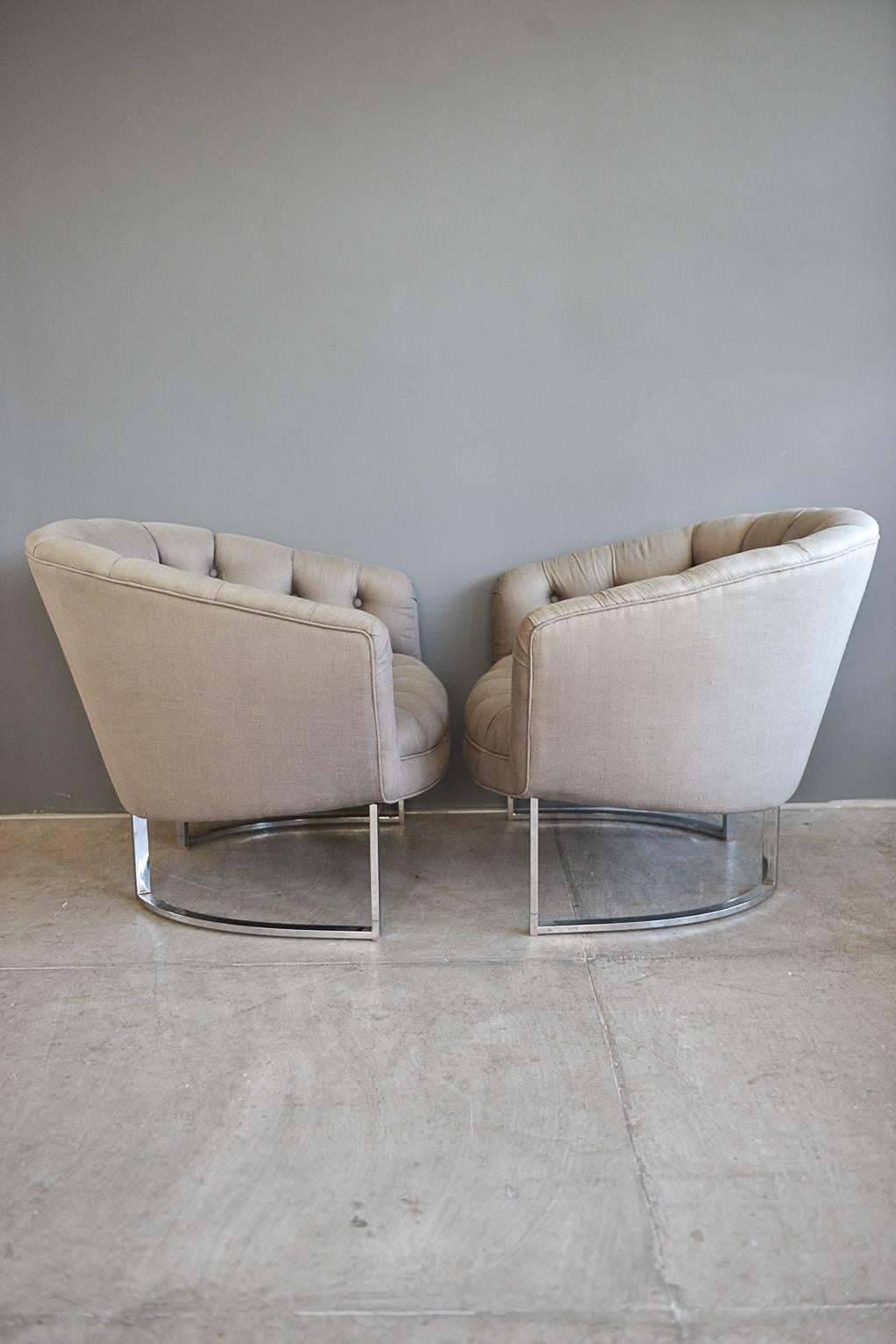 Elegant pair of Biscuit tufted bucket lounge chairs by Milo Baughman for Thayer Coggin, circa 1970s. Reupholstered in beautiful grey linen with deep biscuit tufting. Chrome bases are excellent with no rust. Original floor protectors. Works well with