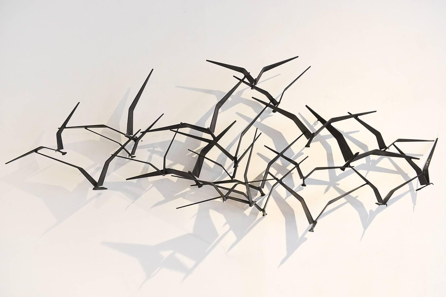 This is a beautiful and original signed 1968 Curtis Jere ‘Birds in Flight’ metal Brutalist wall sculpture. Made of solid iron with sculpted birds, this piece is an iconic and classic Mid-Century design. Incredibly popular and great looking in almost