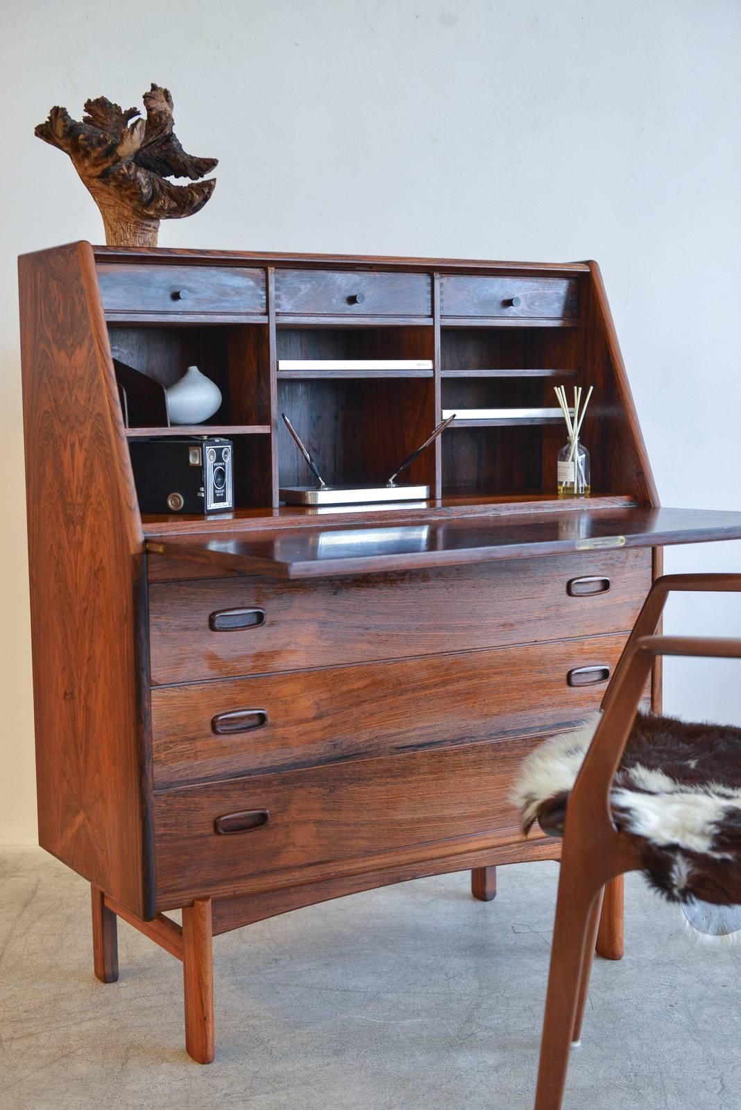 Beautiful and rare rosewood secretary desk by Bernhard Pedersen & Sons of Denmark, circa 1965. Excellent vintage condition, the rosewood grain is fantastic. Inside features a pull down shelf, pull-out writing shelf, three upper drawers with