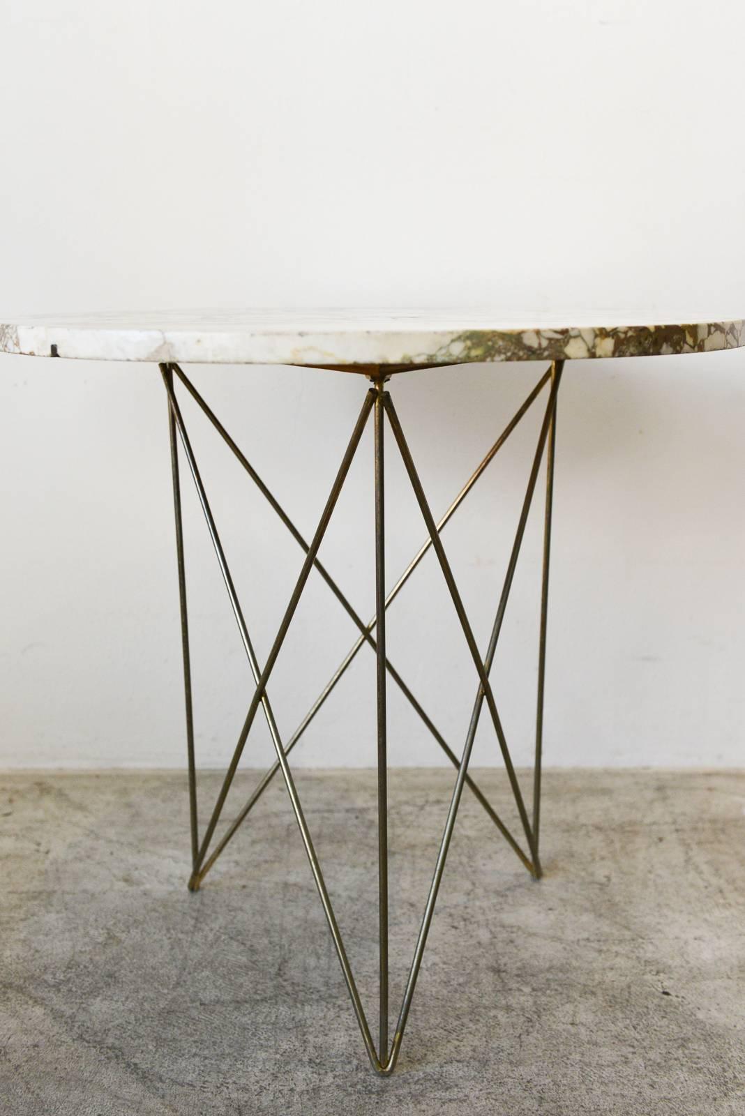 Large and rare Rene Brancusi marble and brass side or occasional table. Beautiful marble top in very good condition, one small repair (see photo 6), otherwise excellent. Beautiful patina on the brass rod legs. Marble made in Italy.

Larger size is