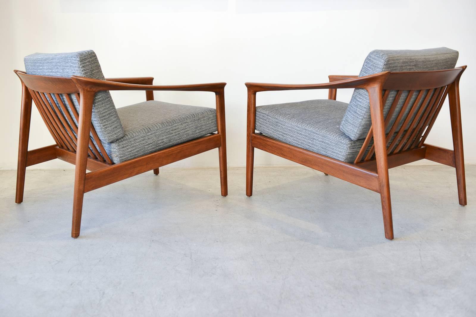 Pair of sculpted lounge chairs by Folke Ohlsson for Bodafors Sweden, circa 1960. Professionally restored birch frames in showroom condition with beautiful grey tweed upholstery and new foam. Seat strapping has also been restored. 

Rare, difficult