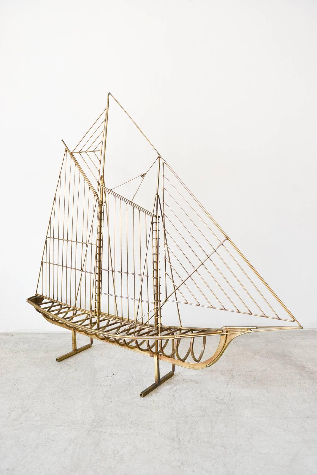 Sculptural brass sailboat by Curtis Jere, circa 1970. Beautiful modern sailboat on floating base. Excellent condition, signed. Original vintage patina. Great nautical design for your home or office.

Measures 41