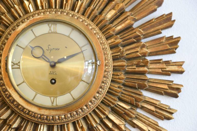 Gold Sunburst Clock by Syroco, circa 1955 at 1stDibs