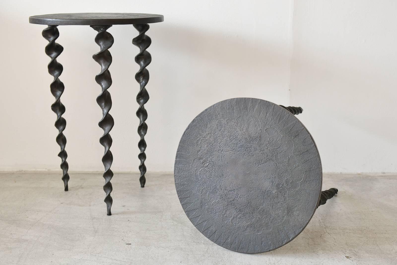 Unique tripod side tables by Michael Aram, crafted in metal with corkscrew tripod legs and oxidized metal table tops and legs. Beautiful design, excellent condition. Sold as a pair.

Each measure 17.5