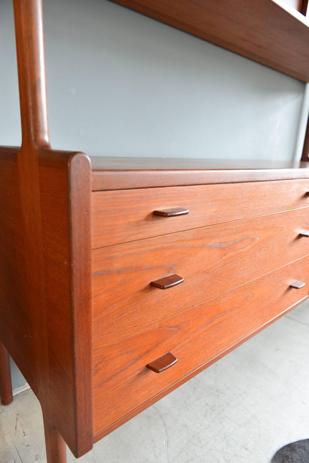 Hans Wegner Model 20 teak credenza or buffet, circa 1960. Mfg. by RY Möbler, marked on back and in excellent vintage condition with no chips or scratches. Original adjustable inner birch shelving and felt lined upper drawer. Classic lines and