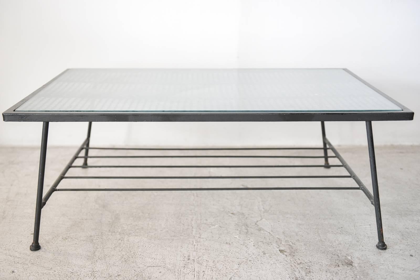 Iron and glass coffee table by Inco Company of California, circa 1955. Excellent original condition. Includes original glass. Could be used indoors or outdoors as patio furniture.

Can be seen in our showroom at MODERN VAULT, 361 Old Newport Blvd,
