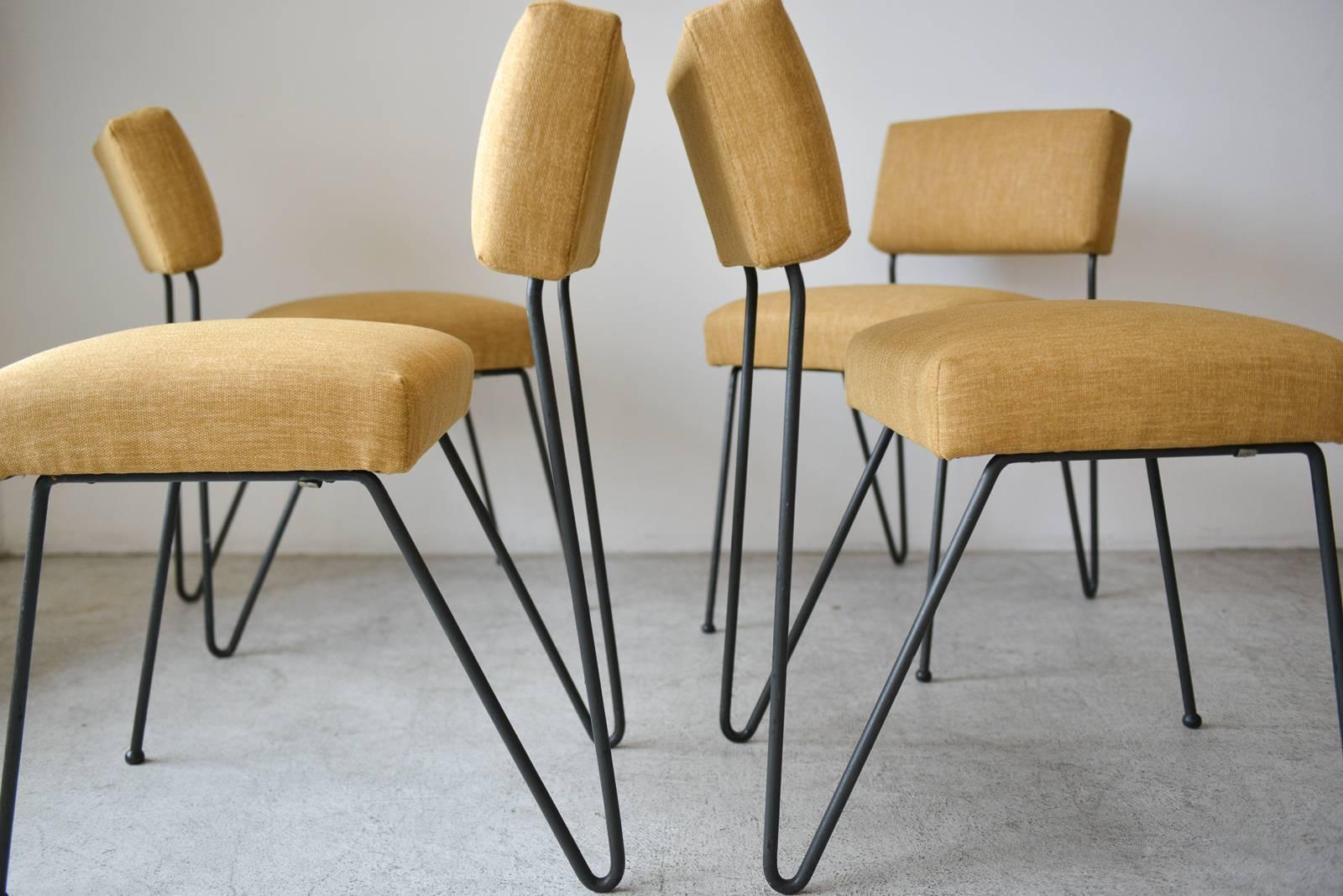 Rare set of four iron chairs by Vista of California, circa 1955. Distinct California modernist style, with cantilever backs. Very reminiscent of Dorothy Schindele, sometimes confused with her work. Professionally reupholstered in beautiful mustard
