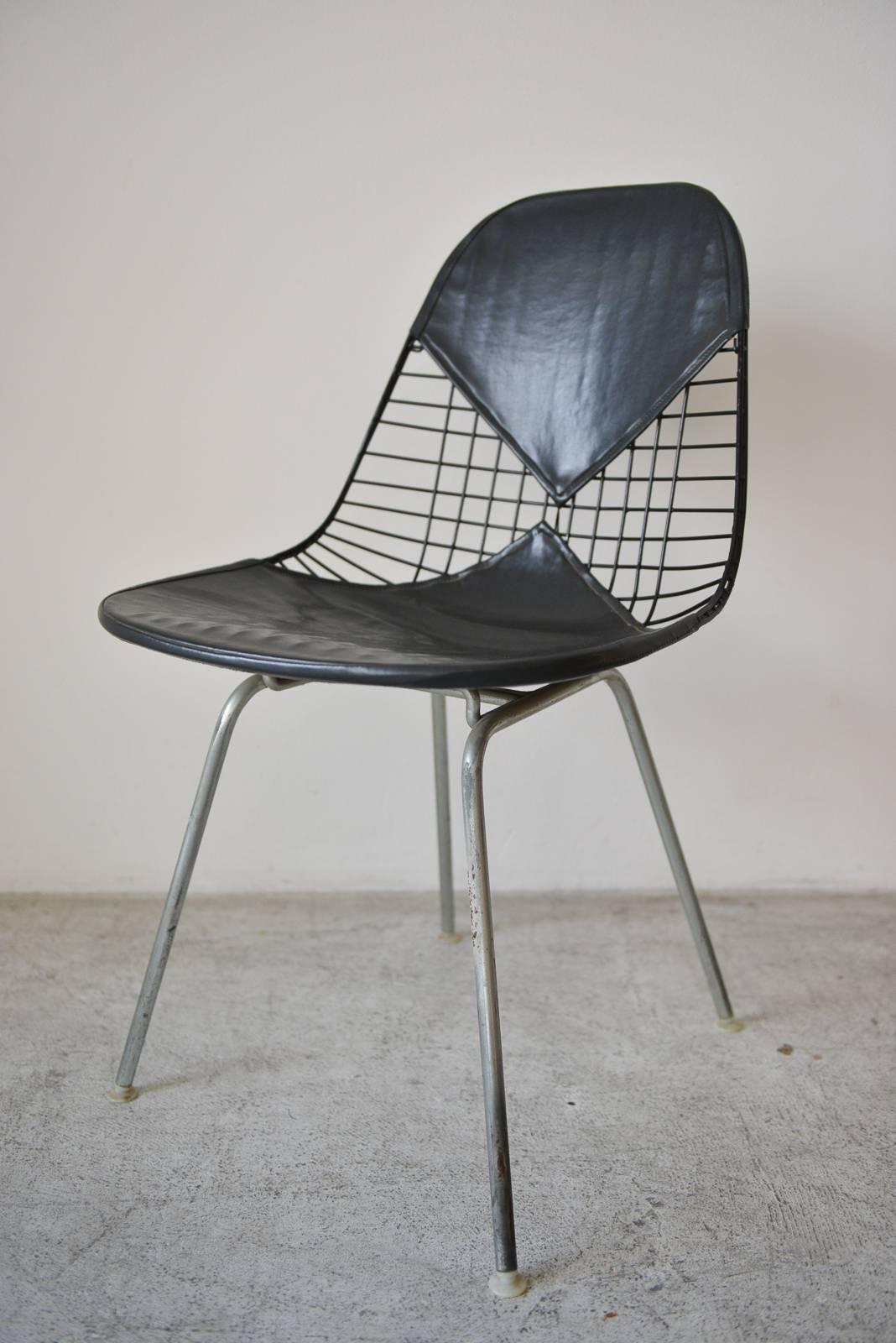Eames DKX-2 vintage wire chair with leather bikini cover. Original condition, leather is good with very little wear and original tags. H-base with original feet.

Can be seen in our showroom at Modern Vault, 361 Old Newport Blvd, Newport Beach, CA