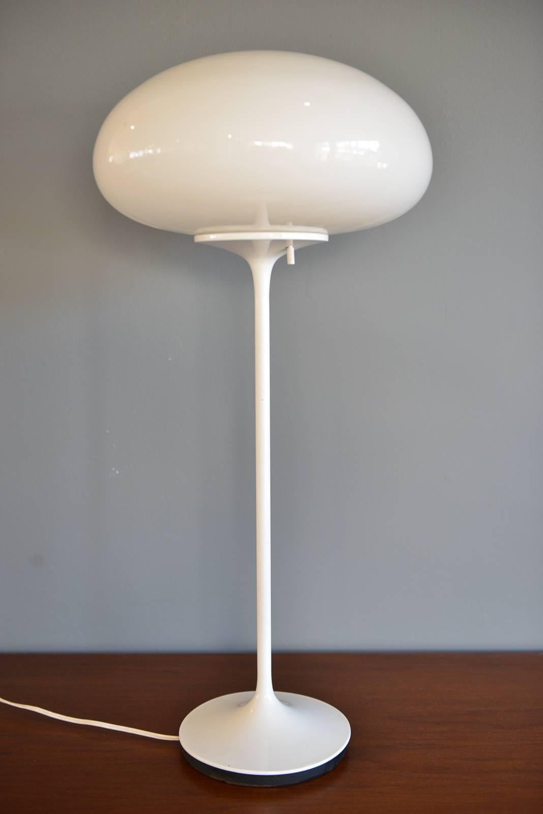 Pair of bill curry Stemlite for design line mushroom floor and table lamps. White enamel stems, original glass mushroom shades. Heavy solid iron bases, original wiring.

Floor lamp base has some wear as shown, table lamp is very good.

Price is for