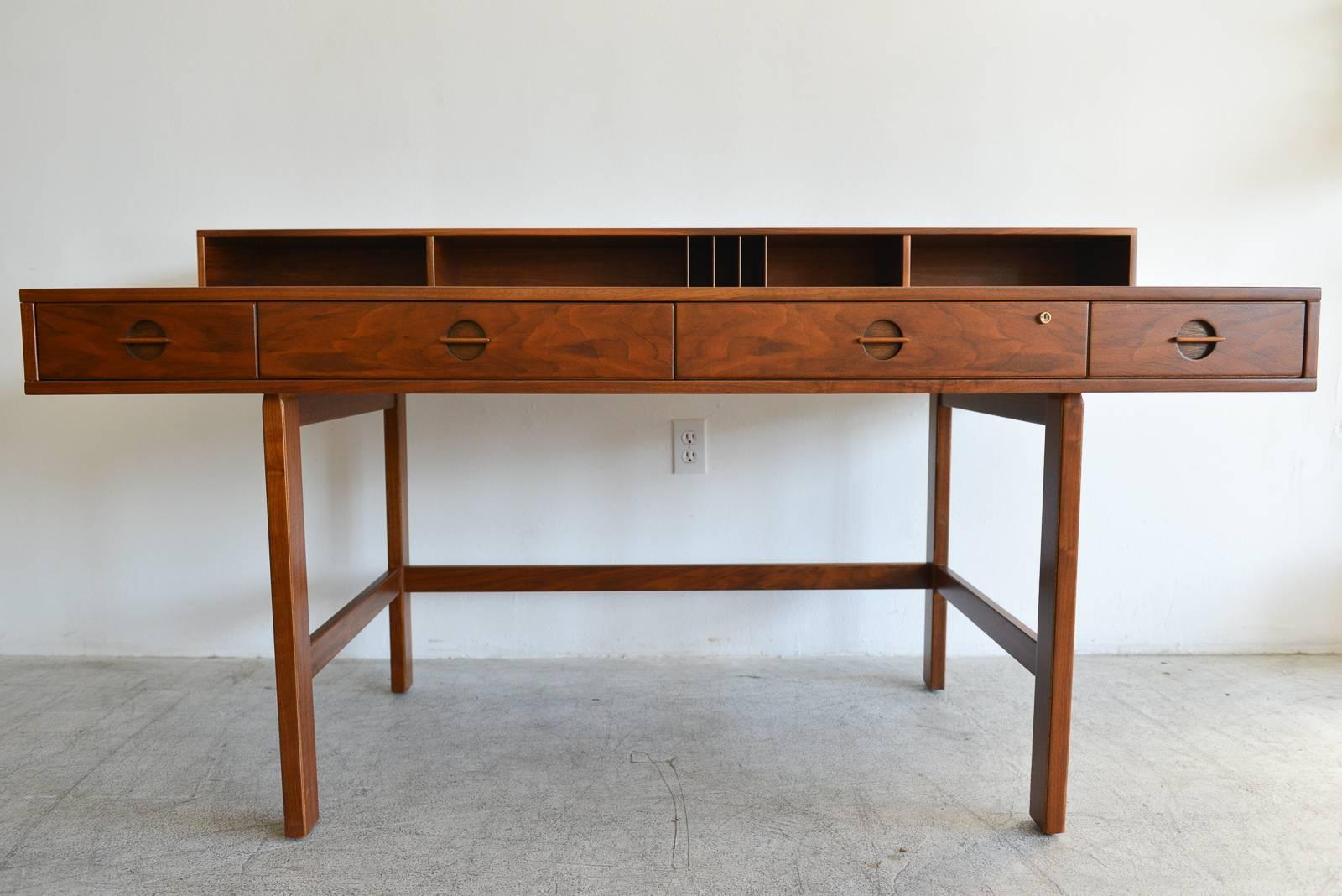 Walnut partners desk by Jens Quistgaard for Lovig, 1971

Professionally restored in showroom condition. Top flips down to reveal larger working area can be used as partners desk or alone. Original brass hinges. Beautiful and more rare walnut as