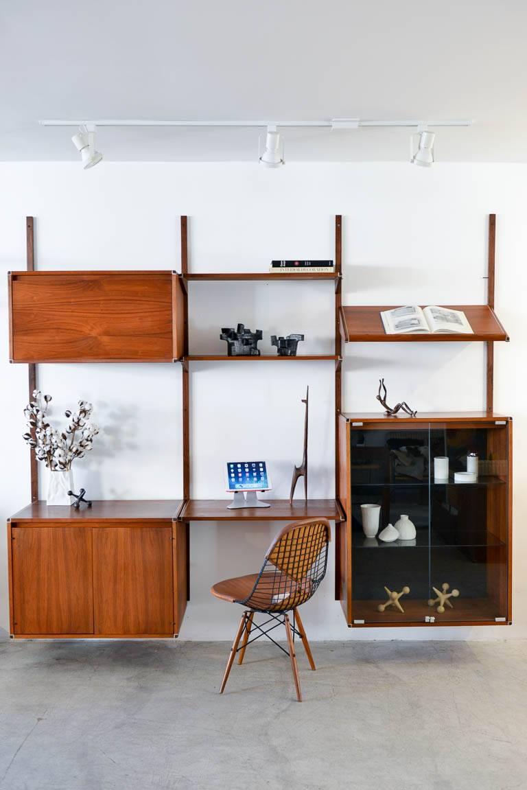 Walnut three wall unit by Barzilay, circa 1970. Beautiful walnut with aluminium accent wall unit or shelving unit by Barzilay of Los Angeles. High quality walnut with aluminium shelving detail. Easily attaches to wall. Price includes three cabinets