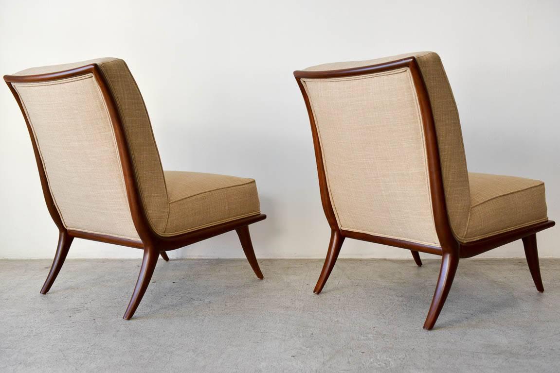 American Pair of T. H. Robsjohn-Gibbings Walnut Sabre Leg Slipper Chairs, circa 1950