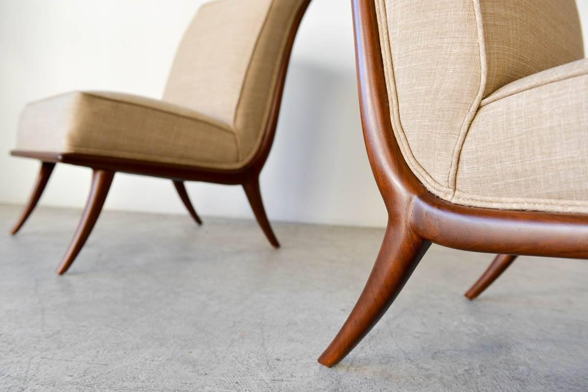 Fabric Pair of T. H. Robsjohn-Gibbings Walnut Sabre Leg Slipper Chairs, circa 1950