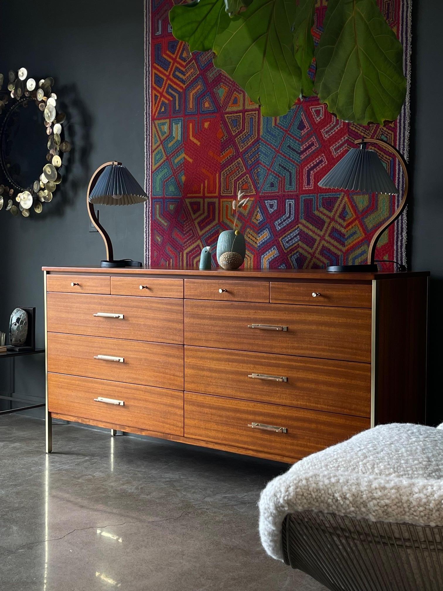 Paul McCobb for Calvin brass and mahogany 10 drawer credenza, ca. 1960. Rare, larger credenza has been professionally restored and brass hardware and frame has been repolished. This is a truly stunning piece, and the larger more rare version by