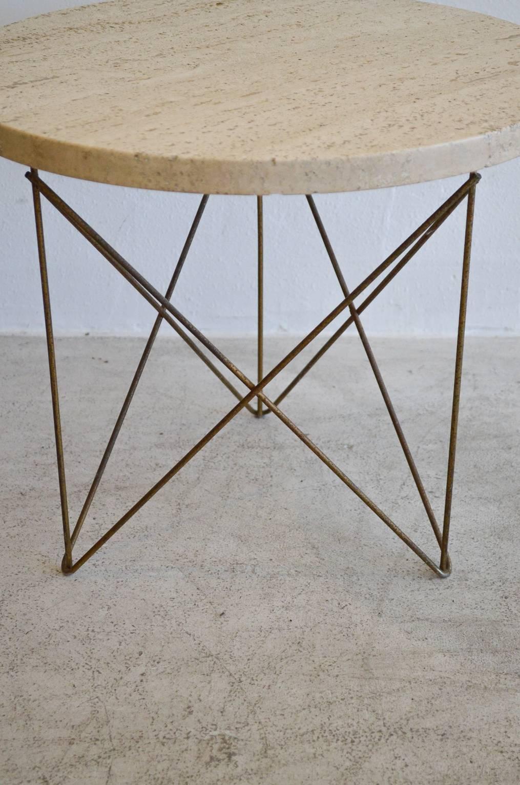 Original Rene Brancusi Italian travertine and brass wire base end or occasional table. Travertine stamped on underside produced in Italy.

In the 1950s Rene Brancusi showrooms in Los Angeles, Miami and New York specialized in imported marble