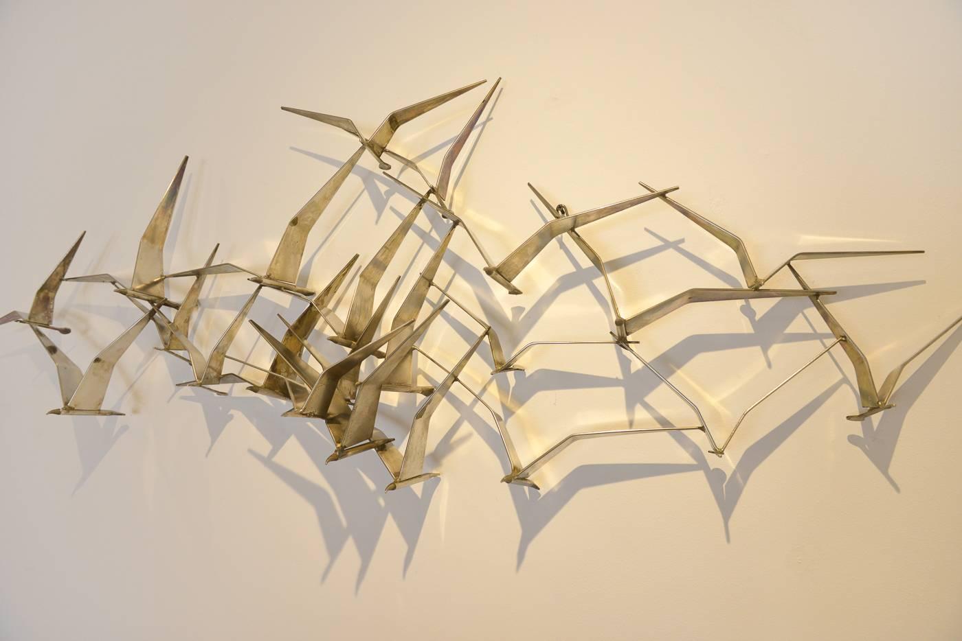Beautiful original Curtis Jere for Artisan House shiny brass birds in flight. Signed C. Jere 1968, this piece is in excellent vintage condition with no rust or missing pieces. Beautiful Brutalist style art for your wall, the shiny brass finish is