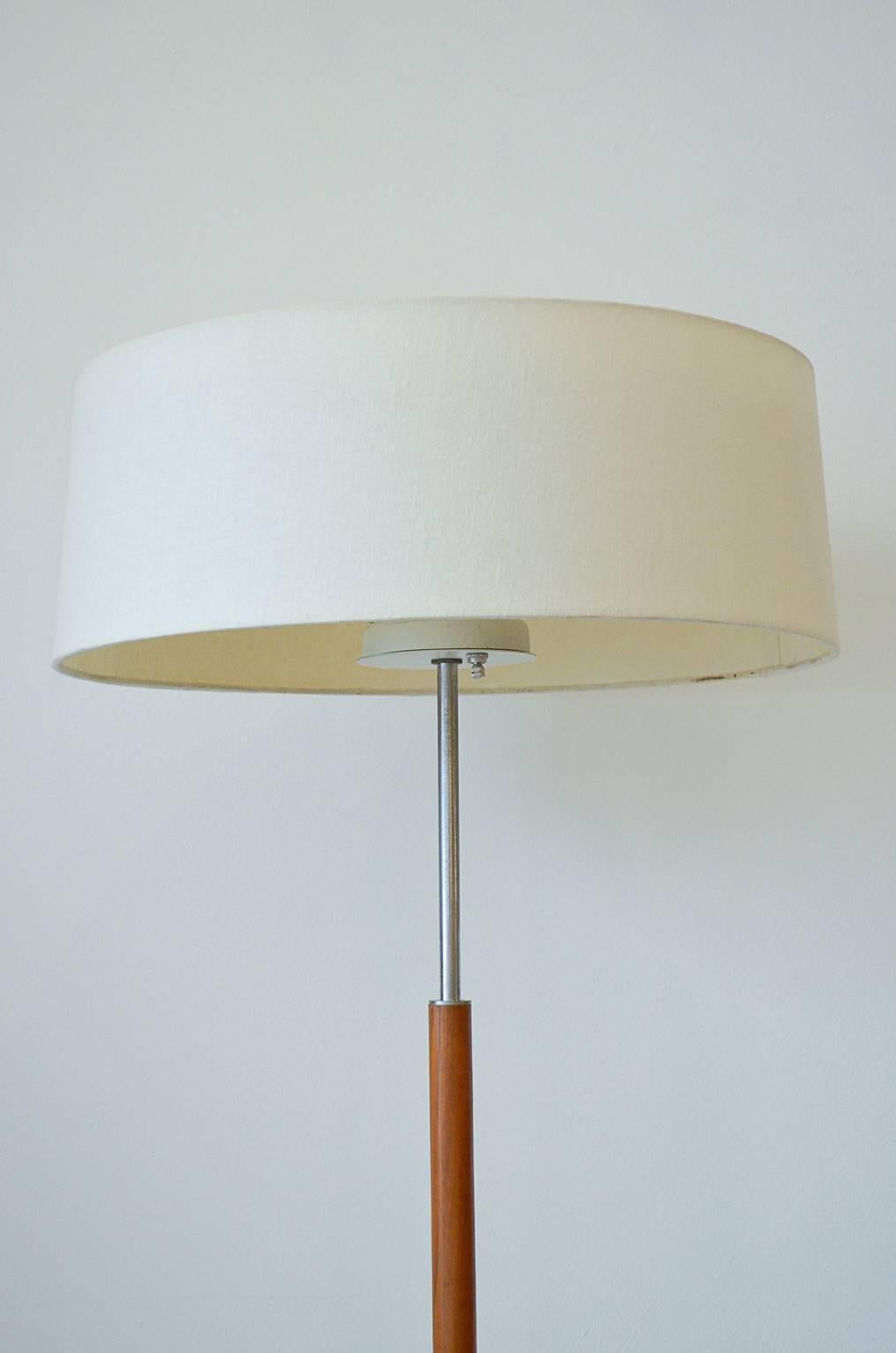 Beautiful standing floor lamp by Gerald Thurston for Lightolier. White laminate table and four star chrome base. Beautiful ivory shade with original top diffuser. Fully adjustable lighting, with three bulbs you can light separately. Shade is