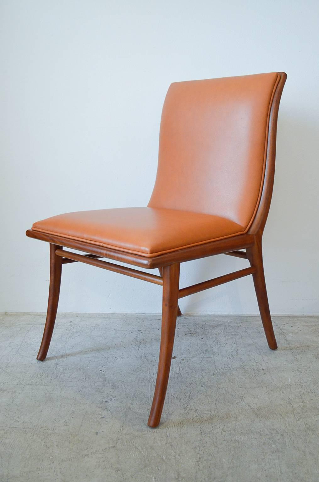 Rare walnut and leather sabre leg accent chair.  Professionally restored in beautiful saddle brown leather with new seat foam.  Walnut has been restored and is in pristine showroom condition.

Perfect for a desk or corner accent chair.

Measures