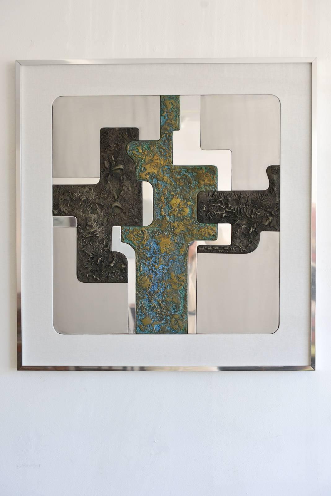 Large, mixed metal abstract wall art signed Lago, 1981 artist proof. Beautiful copper center with polished aluminum, brushed aluminum and pewter inserts. Framed with new linen matting, measures 39" x 38".

Excellent vintage condition,