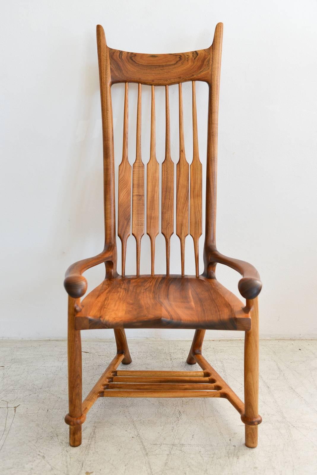Exceptional studio craft lounge chair in rosewood by California craftsman Charles Jacobs b. 1930-d. 2007. Reminiscent of Sam Maloof's work, Mr. Jacobs was heavily influenced by his craftsmanship and design and lived in nearby Claremont,
