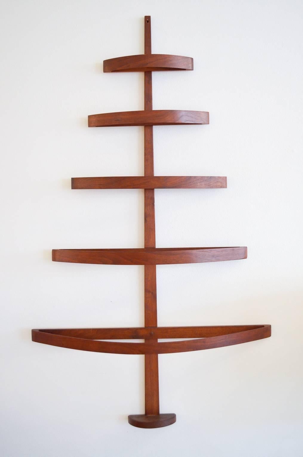 Beautiful rare Danish teak bentwood Christmas tree. Hangs on your wall beautifully and has up to 3-5 hooks per 'branch' to hold your most prized vintage Christmas ornaments.

Perfect addition to your vintage Christmas collection, the tree measures