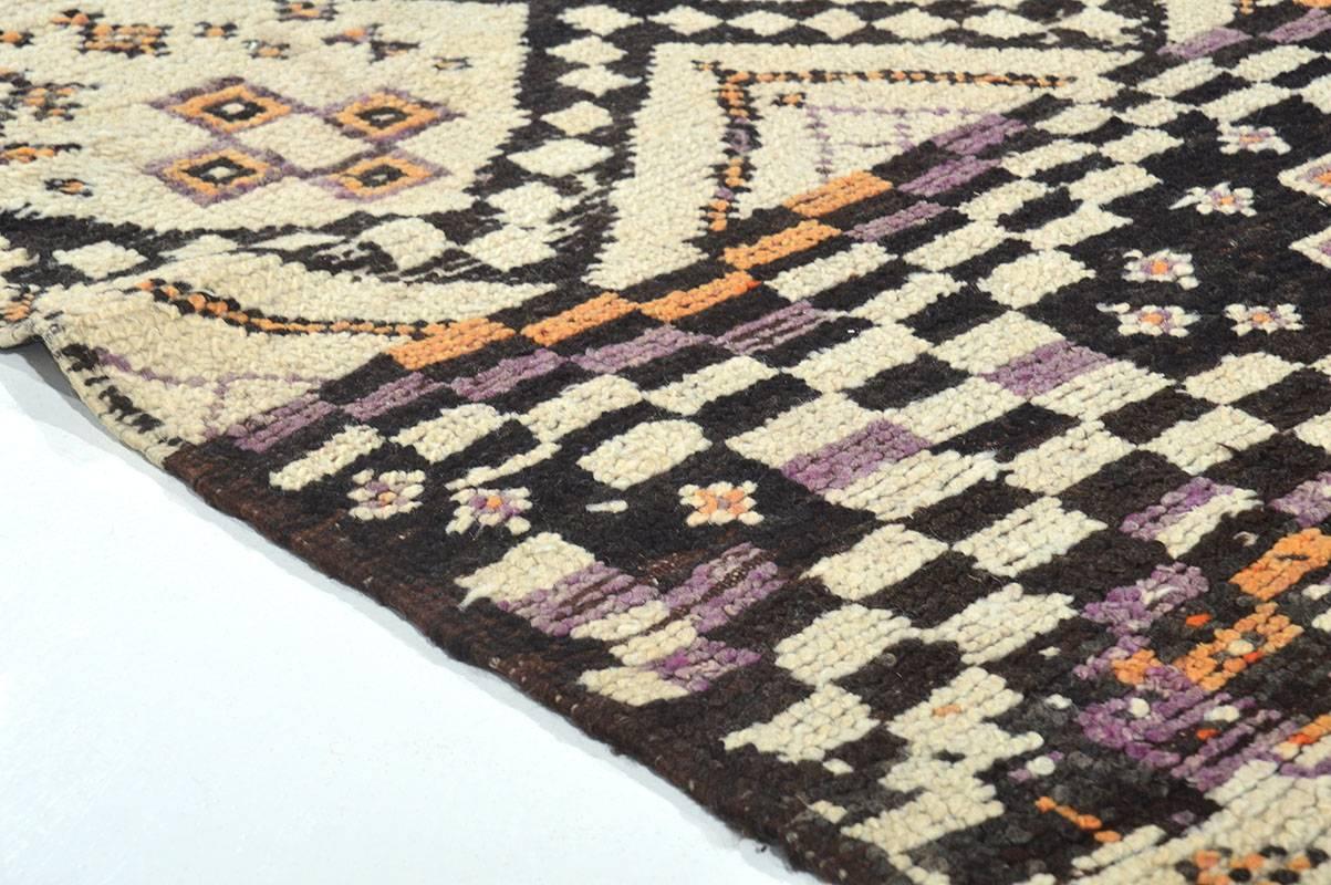 Ait Youssi vintage rugs are traditionally made by Berber women from the Ait Youssi province in the Central Middle Atlas Mountains in Morocco. These artistic abstract rugs were created for personal domestic use. They are handmade from dyed and