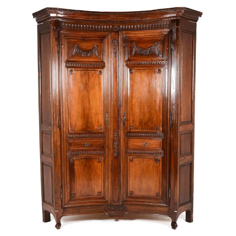 Very rare, French, 19th century, monumental-size corner armoire, with concave curved doors and two shelves, all in solid, hand-carved fruitwood. Circa 1840. 

