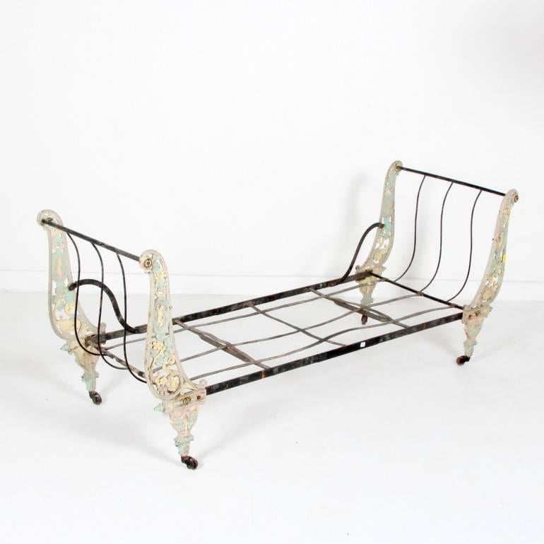 Lovely, small-scale, French antique, child’s campaign bed from the 19th century. In excellent original condition. Would make a great loveseat, bed, or garden feature. Folds down for storage. Sturdy and usable. Measures: 87