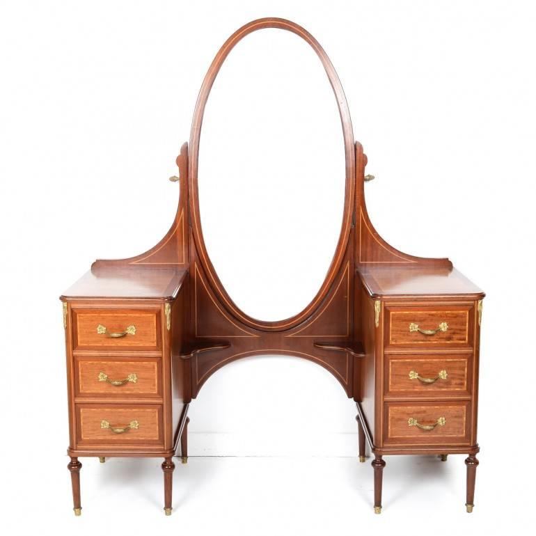 Early 20th century, Louis XVI-style, superior quality French vanity. Mahogany with inlay and superior, highly-detailed bronze mounts. Measures: 52″ wide x 19.5″ deep x 64.5″ tall.