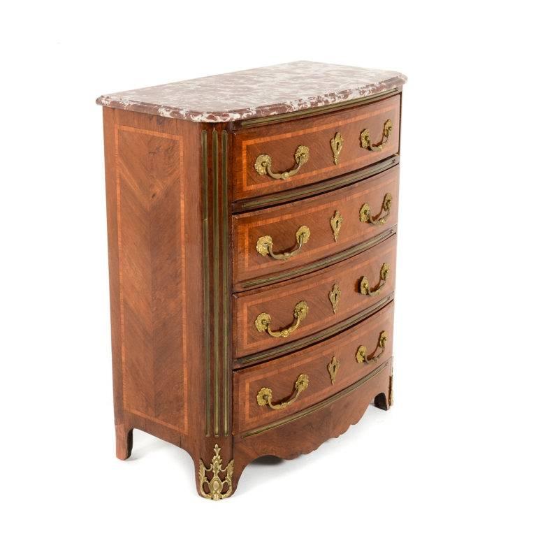 19th century Regency style commode with finely detailed bronze mounts and bronze inlays. Has a lovely rich patina and its original marble in excellent original condition. Kingwood veneers and inlay.

