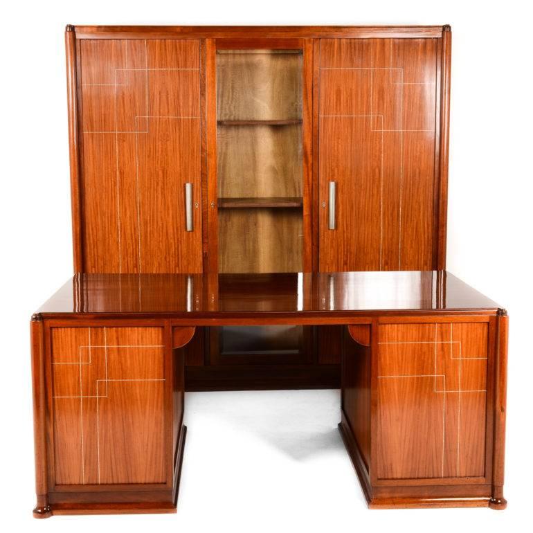 As at home in a 21st Century office as it would have been in the early 1920's, this custom-built transitional Art Nouveau-to-Art Deco executive office set is impressive in the photos and even more so in person. It's created by hand from mahogany