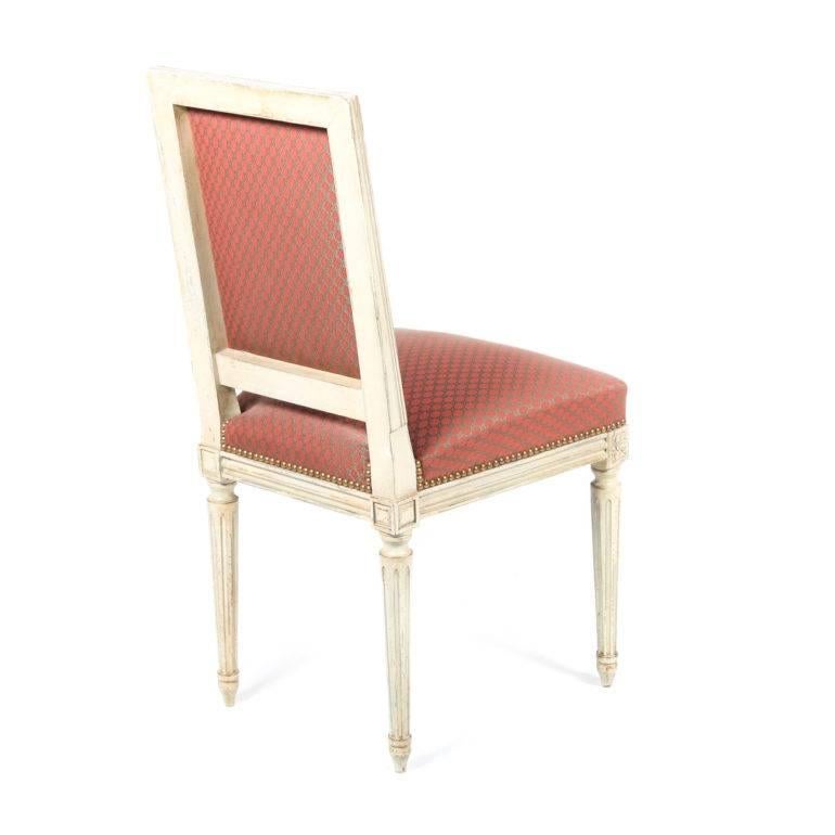 Six French antique Louis XVI-style painted chairs with elegant French upholstery (done in Paris), in excellent original condition. Beautiful original distressing and paint.