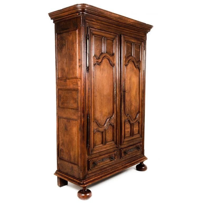 Beautiful condition and patina on this fabulous early 19th century French walnut armoire. Directly imported from France, this piece is breath taking and a complement to any decor. Note the original hardware and shelving, circa 1800.