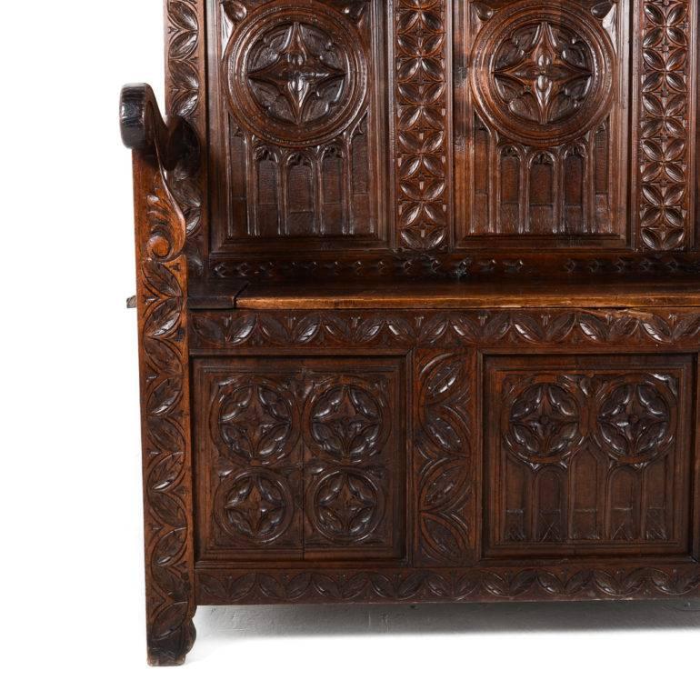 Highly carved Gothic bench from France with storage in the seat. Rare 19th century with beautiful patina. 

