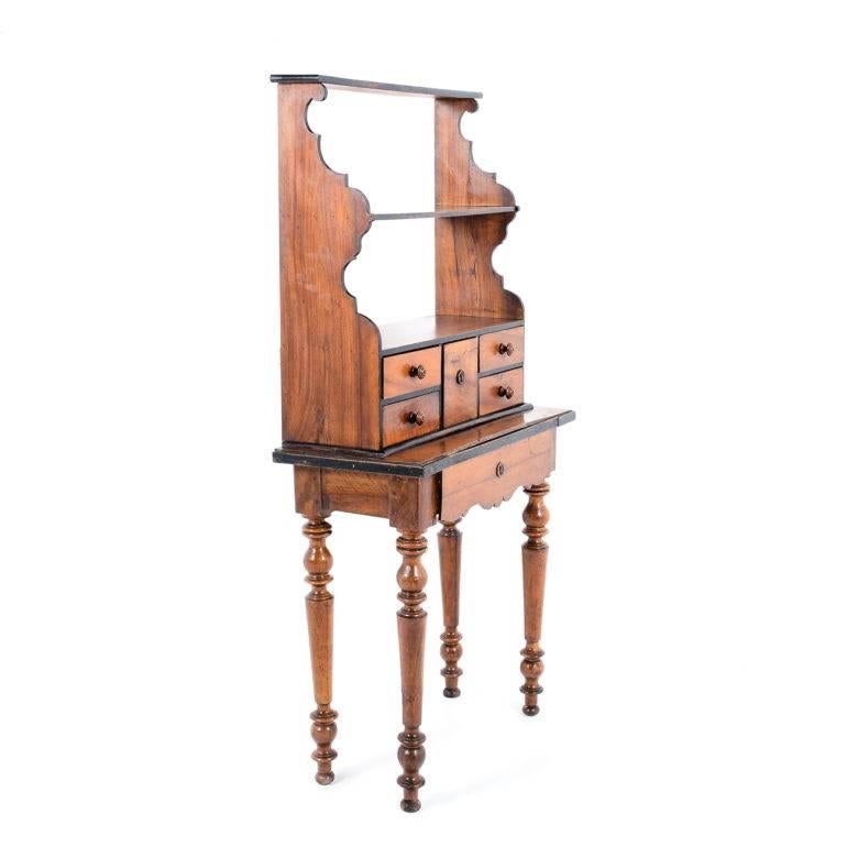 Antique rustic French walnut three-tier stand, raised on ornately-turned legs, with drawers, circa 1880.

