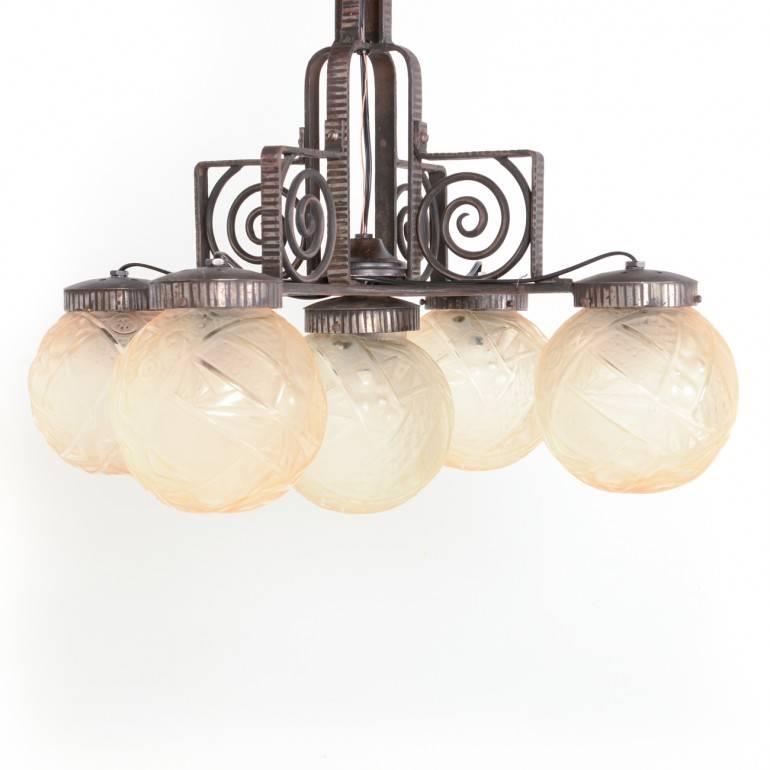 Exceptional quality in this French Art Deco light fixture with Lalique-style globes from France, circa 1920. 

