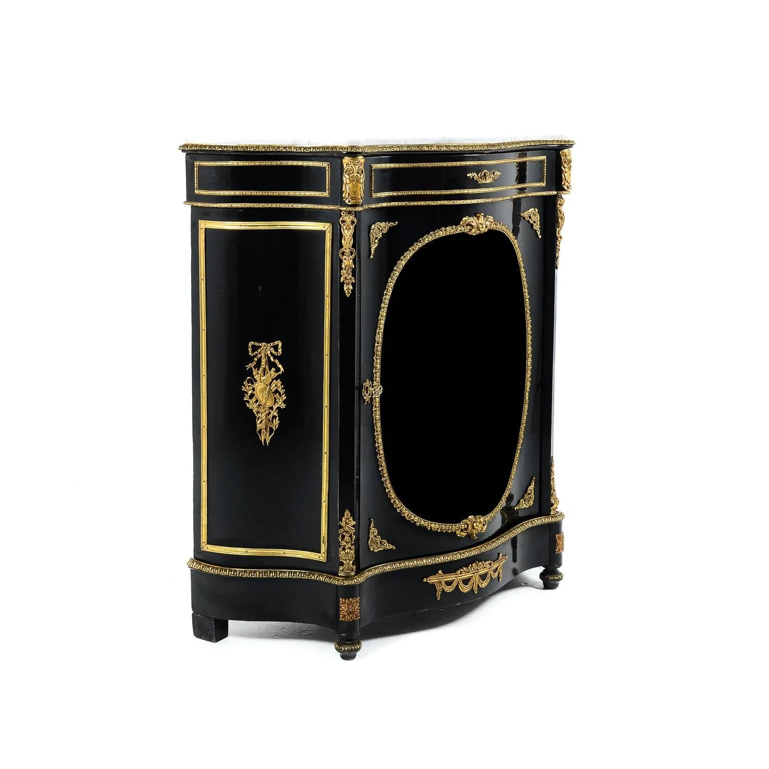 Antique 19th century ebonized Napoleon III marble-top cabinet with fine bronze mounts and the original curved glass, in exceptional original condition, circa 1870. Its dimensions make it a likely candidate for many different rooms in the