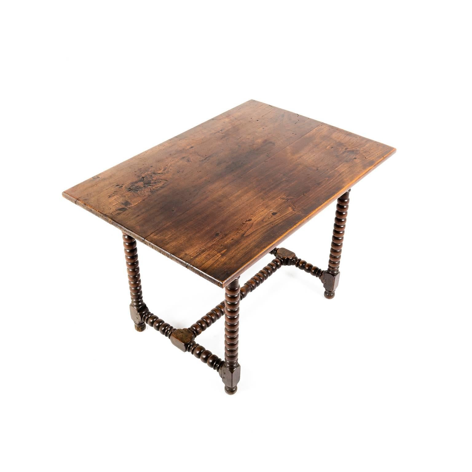 Antique small country French table with bobbin turned legs, circa 1830. A lovely patina on this unique piece, with a size that makes it suitable for a number of different sites throughout the home.



