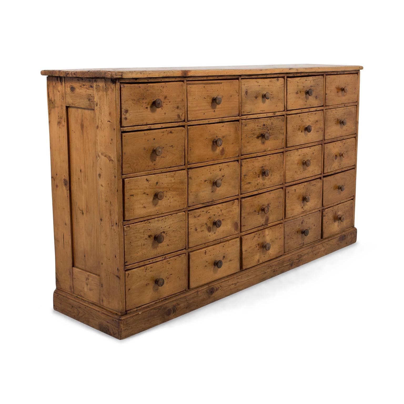 Great patination and wear on this solid pine country French apothecary cabinet with 25 drawers. 19th century, France.