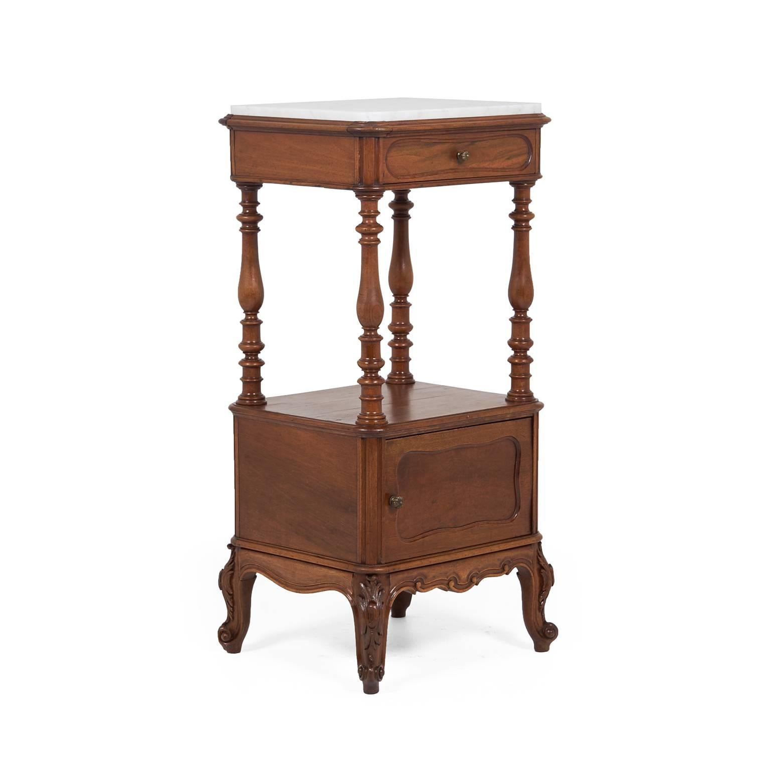 French walnut nightstand with a lovely contrasting color marble top. One small drawer and one lower storage space, 19th century.



 