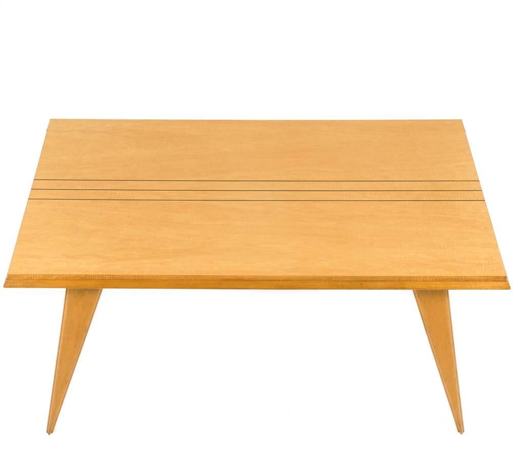 Fantastic Palm Springs design on this satinwood French Mid-Century Modern table. Has 6 matching chairs that are equally as cool.  Leaves can be made for this table at an extra charge. 
