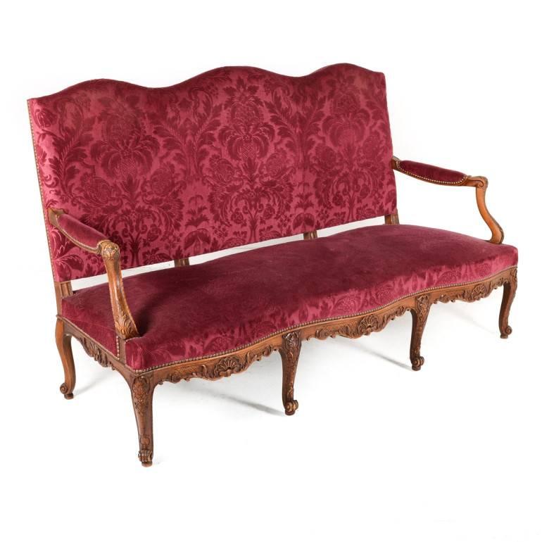 A hand-carved oak-framed salon suite, consisting of a generously-proportioned sofa and two armchairs; the velvet brocade upholstery is in excellent condition.
The set is well-proportioned, sturdy and larger-scale than most French sofas and chairs,