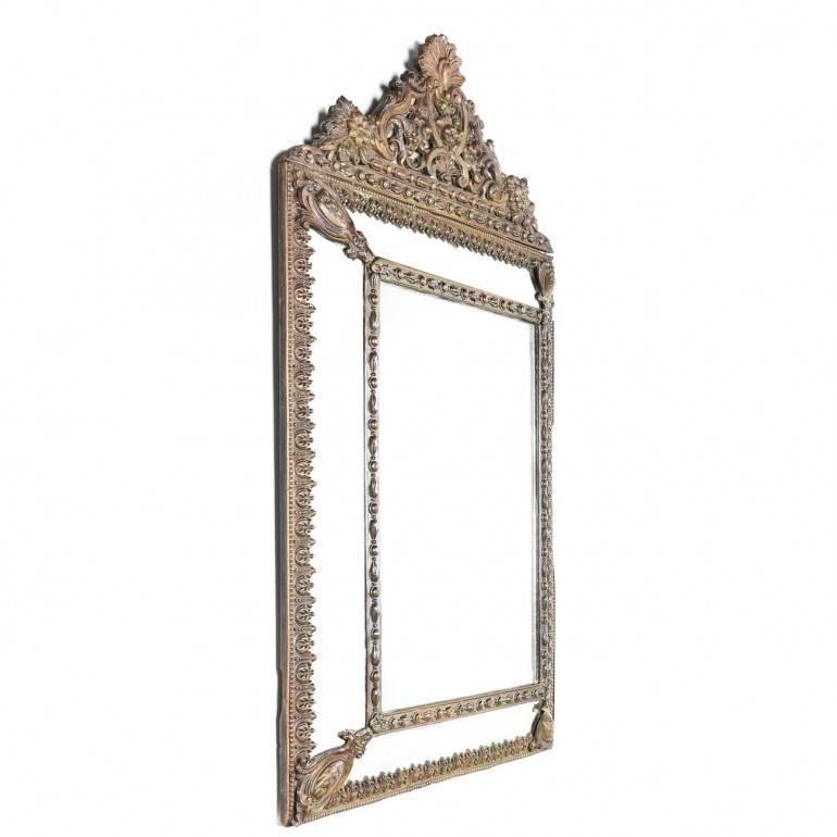 19th century French Repousse mirror in brass and hand bevelled mirror.