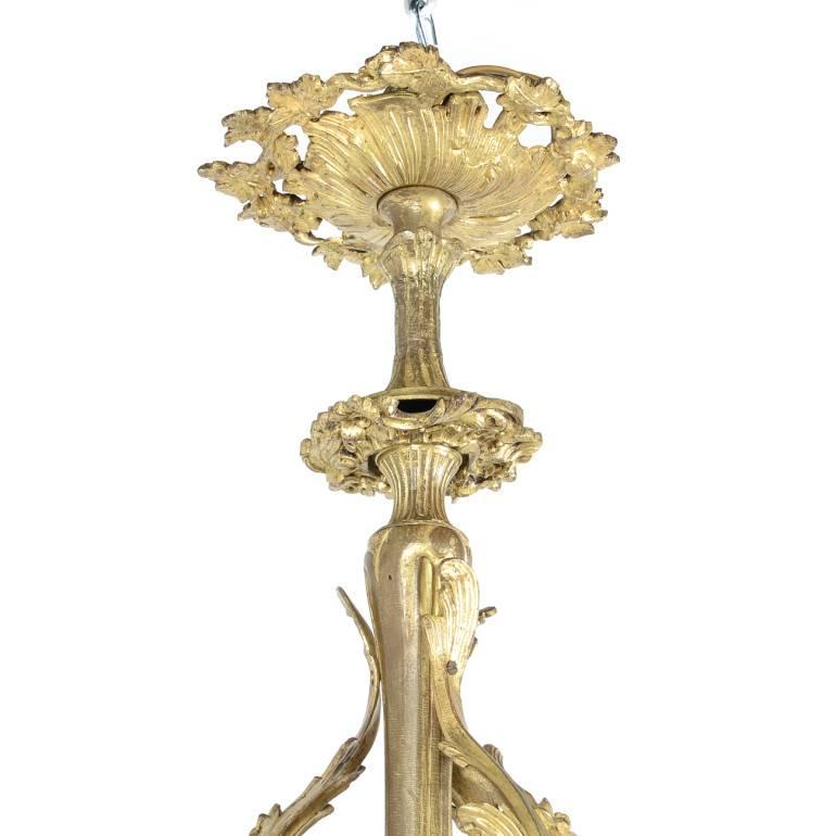 French gilt bronze Louis XV-Revival 12-arm chandelier from Paris, with floral motif. Requires rewiring.

